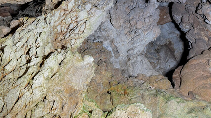 Craggy underground whispers in limestone labyrinth, reminiscent of Earth Day excursions and...