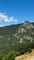 Obraz premium Majestic mountains bask in vibrant sunlight, whispering secrets of ancient myths and midsummer folklore, perfect for Earth Day celebrations