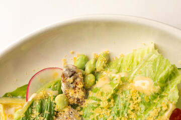 Crisp lettuce cascades with umami edamame and golden miso drizzle, evoking Cherry Blossom Festival and Umami Day celebrations