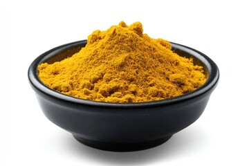 Golden spice powder in dark bowl