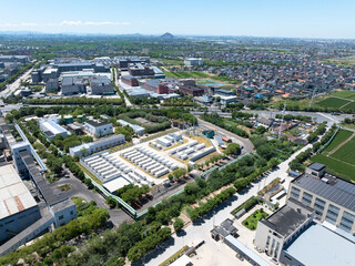 Aerial view of battery energy storage systems under a clear blue sky
