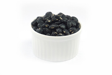 Black beans in a bowl on a white background.