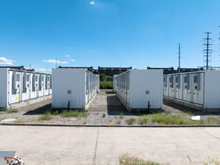 Aerial view of battery energy storage systems under a clear blue sky