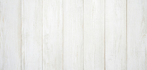White wooden planks arranged vertically creating a textured background surface with subtle grain lines and clean rustic charm that blends modern brightness with timeless style.