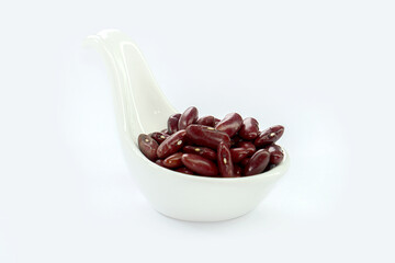 Red beans in a bowl on a white background.