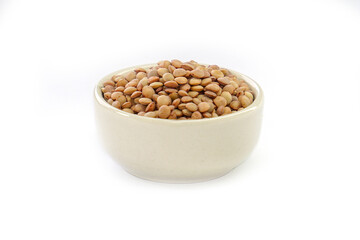 Vicia lens or Lens culinaris (Lens culinaris). Lentils brown, contains protein and soluble fiber, is a source of vitamin B.in a bowl on a white background.