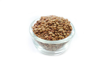 Vicia lens or Lens culinaris (Lens culinaris). Lentils brown, contains protein and soluble fiber, is a source of vitamin B.in a bowl on a white background.