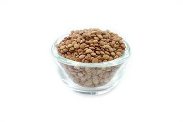 Vicia lens or Lens culinaris (Lens culinaris). Lentils brown, contains protein and soluble fiber, is a source of vitamin B.in a bowl on a white background.