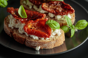 Tasty ciabatta with sun dried tomatoes in olive oil, ricotta and basil.