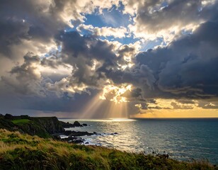 Dramatic coastal scene at sunset, with dramatic clouds and sunbeams piercing through the stormy sky.