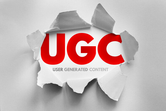 UGC (User Generated Content) concept revealed through torn paper, symbolizing authenticity, creativity, and audience engagement in digital marketing and content creation strategies