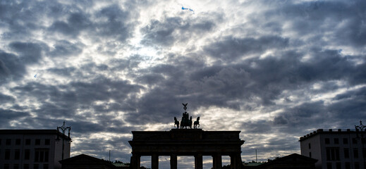 A statue and cloudy sky in Berlin Germany