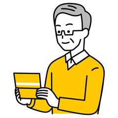 預金通帳を見る年配の男性