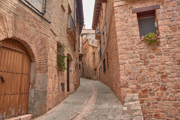 The traditional architecture and cobblestone streets of Alquezar, a tourist destination in northern Spain