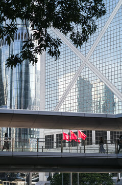 Facade of modern building and chinese flags, Hong Kong