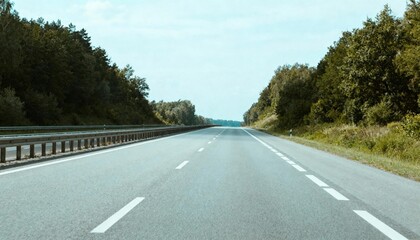 Open Highway Through Lush Greenery: A Serene Road for Travel and Transportation Concepts