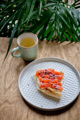 Light and healthy breakfast - sandwiches of bran bread and salmon, decorated with rucola and white sesame seeds. Light and hearty breakfast, healthy food, easily digestible protein