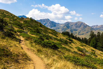 The Arbizon Massif seen from the Col d’Aspin, surrounded by verdant valleys and forested slopes of the Hautes-Pyrénées