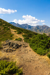 The Arbizon Massif seen from the Col d’Aspin, surrounded by verdant valleys and forested slopes...