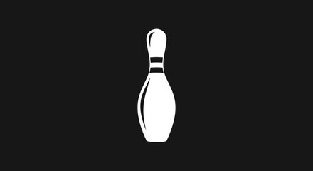 Fototapeta premium Single white bowling pin standing upright on a dark background.