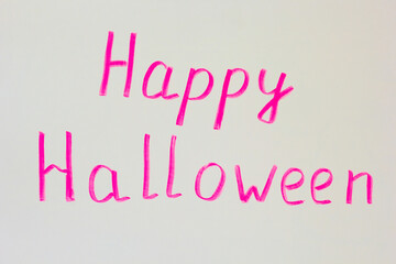 Happy Halloween pink marker handwritten text on white background
