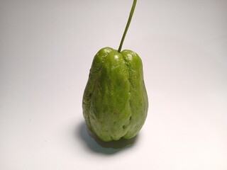 Organic chayote squash isolated on white background. Chayote is a type of typical Indonesian vegetable. which is beneficial for health