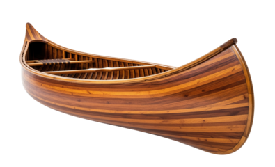 A beautiful wooden canoe with a decorative strip of carved wood and a smooth, polished finish is on a clean white surface. Isolated transparent background ( cut-out PNG file ).