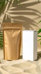 Kraft paper pouch and white box mockup on sand with palm leaf shadows and green foliage
