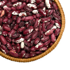 Wicker bowl overflowing with fresh cranberry beans on transparent background