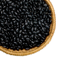 Black beans filling a woven basket on transparent background