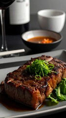 Grilled steak, Asian-style, served on a plate with greens and sauce