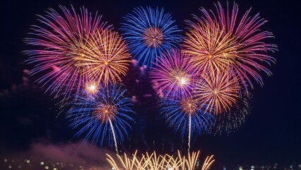 Fototapeta premium Vibrant fireworks explode in night sky celebrating joy