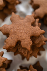 Decorating Snowflake Chocolate Ginger Sugar Cookies with Royal Icing and Sugar Crystals