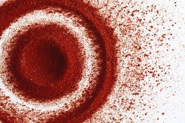 Red spice powder in concentric circles, scattered