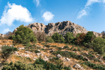 Sierra de Bernia mountain range in Alicante, Spain. Limestone peaks rising above Mediterranean hills, scenic hiking and trekking location on Costa Blanca.