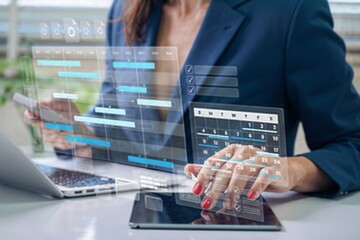 Businesswoman using digital project management interface with calendar, task scheduling, and charts on a tablet, representing productivity, planning, and modern business technology solutions.