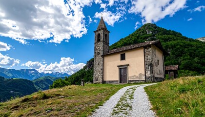 Fototapeta premium A quaint, light beige stone church stands proudly on a hilltop, overlooking a valley of lush greenery and snow-capped mountains under a vibrant blue sky.