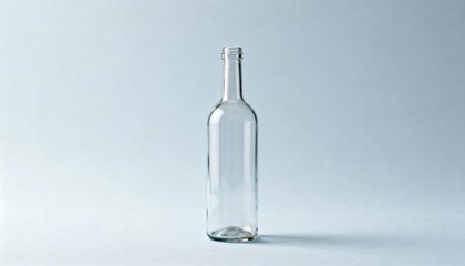 Fototapeta premium Elegant Empty Glass Bottle Mockup, Ideal for Beverage, Liquid Product Packaging and Creative Still Life Photography