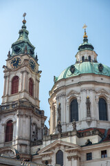Fototapeta premium Church of Saint Nicholas, Baroque Roman Catholic Church in Mala Strana district in Prague, Czech Republic