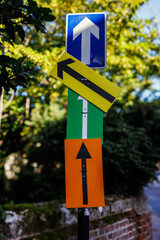 Arrow signs in a vertical signpost