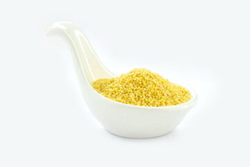 Millet in a White spoon-shaped cup on a white background.