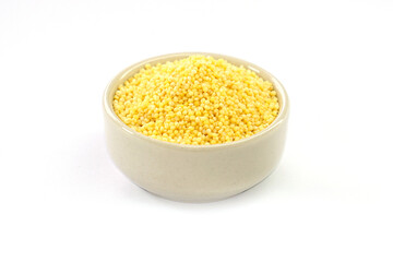 Millet in a bowl on a white background.