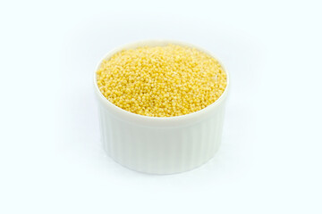 Millet in a bowl on a white background.