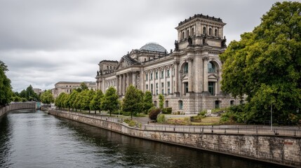 Reichstag Building in Berlin, Germany, Reflecting in the Spree River Under Overcast Sky
