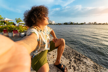 Hispanic man enjoying sunset in Cartagena de Indias