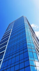 Obraz premium Modern skyscraper against a clear blue sky