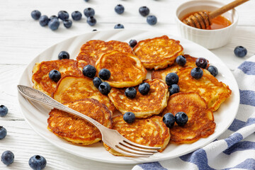 fried hot and crispy pancakes with blueberries