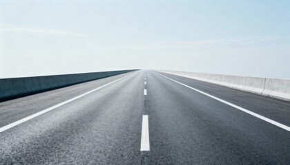 Fototapeta premium Endless Asphalt Road Under a Pale Sky, Highway Stretching into the Distance, Freedom and Travel Concept
