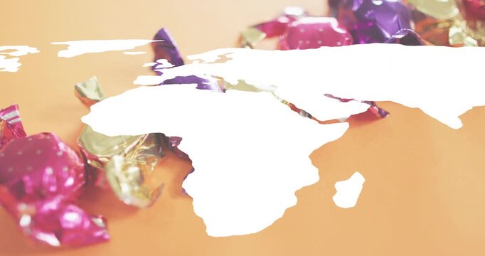 Map silhouette opening on candy wrappers starting blue pins marking regions fading backdrop reveal