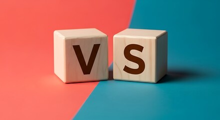Two wooden blocks with letters V and S on red and blue split background